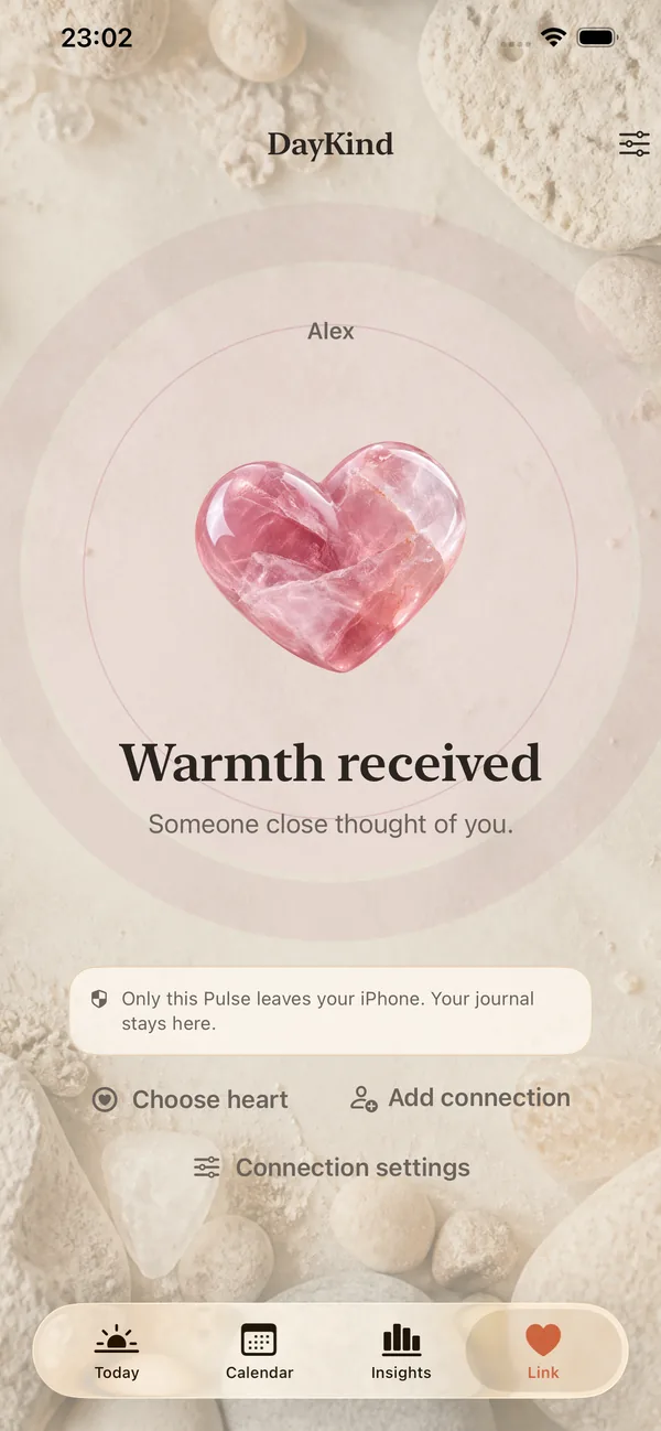 DayKind Link screen showing a rose quartz heart with the words Warmth received — someone close thought of you.